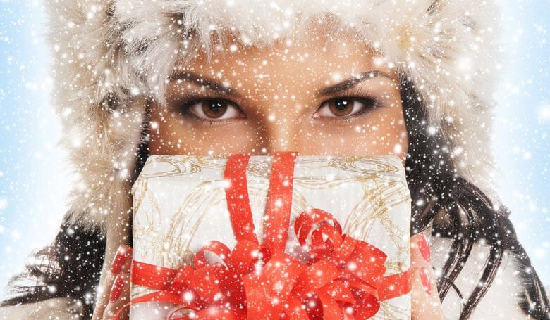 woman holding winter holiday gift