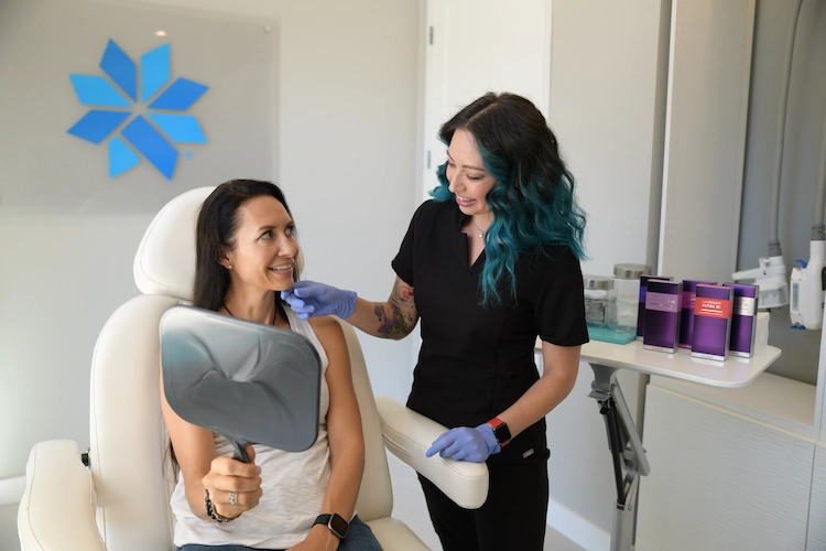 A client and an aesthetician smiling at eachother at beyond|Aesthetics